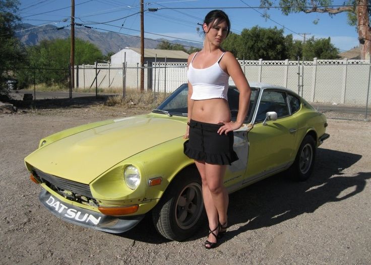 pretty girl in front of a datsun 240z