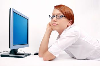 redhead girl using computer