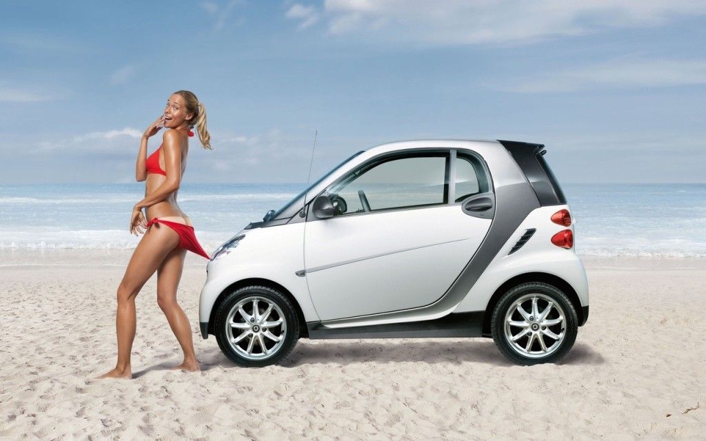 girl in bikini with electric smart car